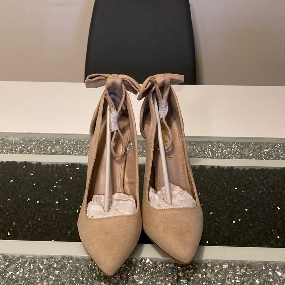 Beige 4 inch heel with ankle strap and bow in the back faux suede by Jolimall